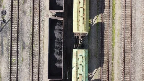 Top-down view on railroad and carriages full of coal. Stock Footage 163538601