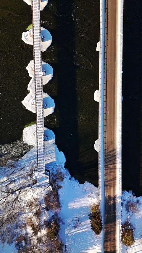 Top Down View of Railway Bridge and Hydroelectric Plant Over Trent River in 動画素材 332738253