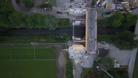 Top down view of railway construction site and new bridge over small river Stock Footage 341801291