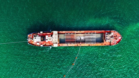 Top-down view of red dredging barge anchored in turquoise sea, Bulgaria Stock Footage 337197698