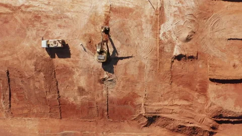 Top-Down View of Red-Soil Excavation and Machinery on Future Housing Site Stock Footage 310460258