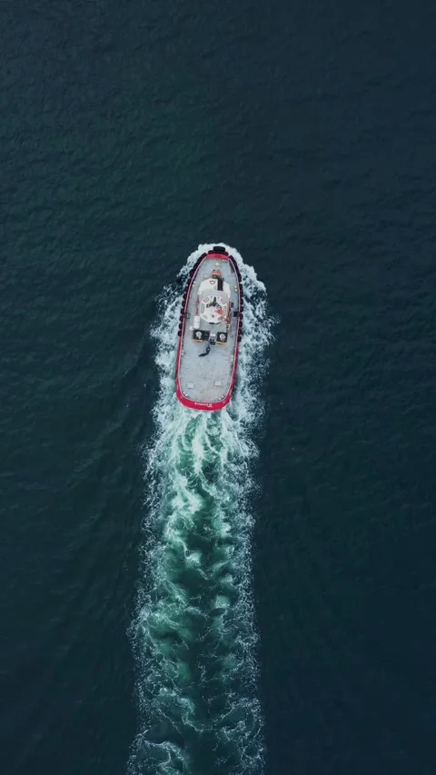 Top down view of a red tug in sea. Logistics and transport 스톡 동영상 299705084