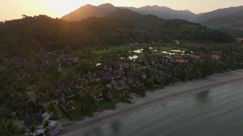 Top-down view of resort villas on Paradise Beach at dawn, Koh Chang, Thailand Stock Footage 310390614