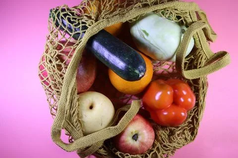 Top-down view of a reusable mesh grocery bag filled with a  fruits Stock Photos