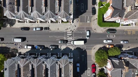 Top down view of a road junction with a zebra crossing, bus stop markings and Stock Footage 343468870