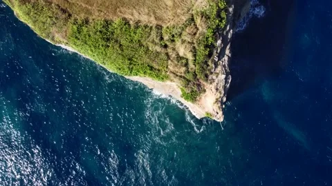 Top down view on rock cliff in ocean Stock Footage 159330789