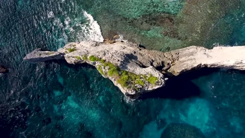 Top down view on rock cliff in ocean Stock Footage 159639793