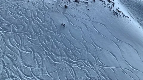 Top Down View Of Rocky Snowy Mountain With Skiing Tracks Stock Footage 237337475