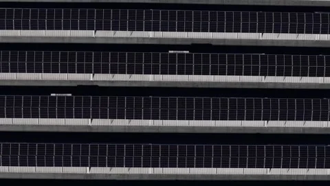 Top down view of rooftop solar panel array with horizontal photovoltaic grid Stock Footage 331058537