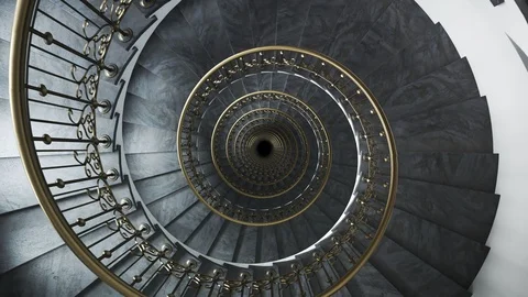 Top Down View of Rotating Spiral Staircase with Gold Railing Stockbeeldmateriaal 91271451