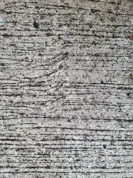 Top down view of rough weathered concrete texture with horizontal lines Stock Photos