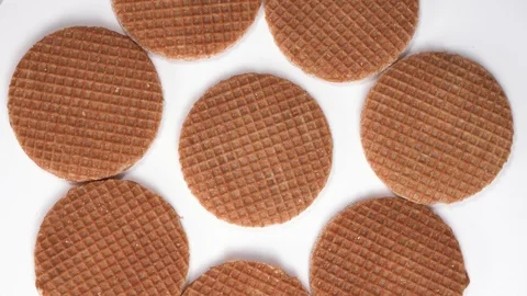 Top down view on round waffle cookies rotate or spin on the table. Sweet cookies Stock Footage 124284649