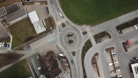 Top down view roundabout with heavy traffic in Swiss city. Video stock 149908625
