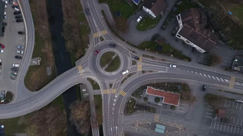 Top Down View of Roundabout With Morning Traffic Flow Commuting Cars Видео 331441822