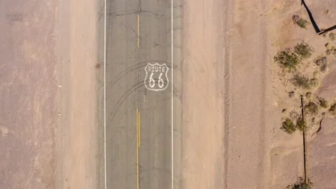 Top down view of route 66 as car passes highway marker. Drone. Stock Footage 146625187