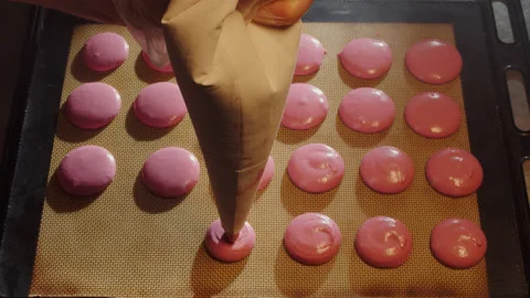 Top down view of rows of pink cookies. Symmetry in kitchen. Stock Footage 149125138