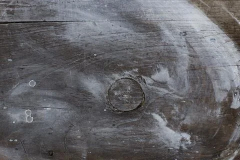 Top-down view of a rustic dark brown wooden surface featuring a distressed .. Photos