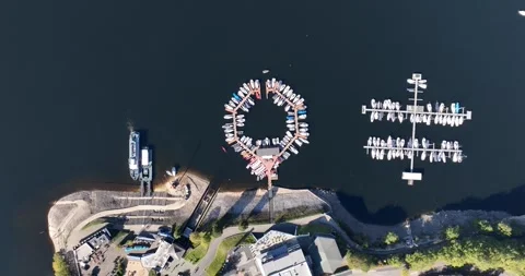 Top down view on sailing ships and small motor boats on a pier in a cirlce Stock Footage 288872536
