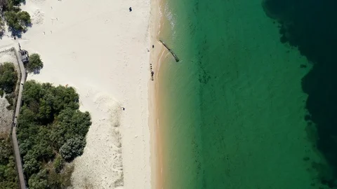 Top down view of sandy beach with transparent water. Paradise in Troia Portugal Stock Footage 130140022