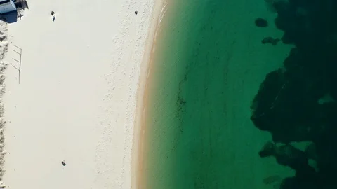 Top down view of sandy beach with transparent water. Paradise in Troia Portugal Stock Footage 130140048