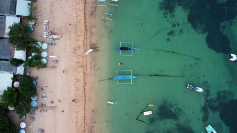 Top down view on sandy beach with reef and boats Stock Footage 156312441