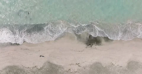 Top down view of sandy beach. Aerial seascape of beautiful beach Stock Footage 191698871