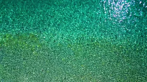 Top-down view of sea azure waves pattern and crystal clear water. Rhodes, Greece Stock Footage 301541959