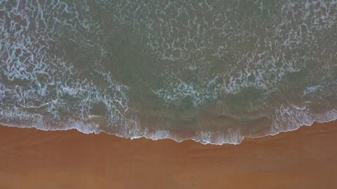 Top down view of sea shore and smooth wave raise up Stock Footage 145428183