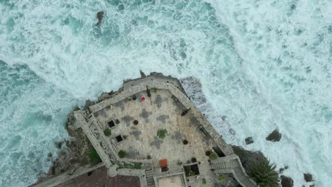 Top down view sea wave crashing on the fortress wall Stock Footage 232791510