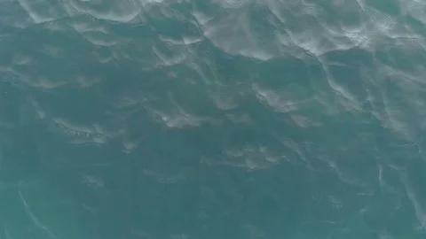 Top-down view of the sea waves. The camera is very low above the water. Sea Stock Footage 119394314