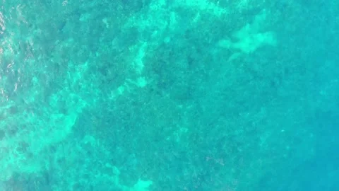 Top-down view of the sea waves. Calm sea shot from above. Aerial view Stock Footage 154458043