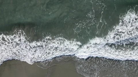 Top down view of sea waves crashing on the shore, Aichi, Japan Stock Footage 325832884