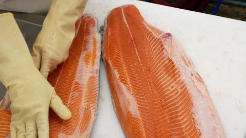 Top down view to seafood working place while cutting fresh big salmon on th.. Stock Footage 289813352