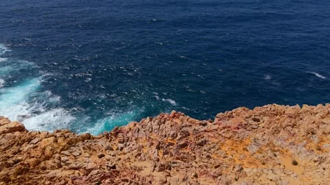 Top down view seashore cliffs wave crashing on rocks. Sardinia, Italy. Stock Footage 301542750