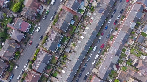 Top down view of semi-detached housing and suburban streets, England Stock Footage 336481411