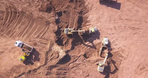 Top down view of several excavators working on a construction site. Stock Footage