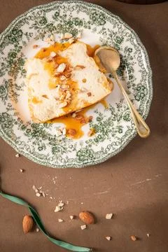 A top-down view showcases a piece of traditional caramelized egg white pudd.. Stock Photos