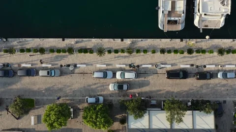 Top down view sidewalk and car road near the coast of sea. Stock Footage 234019579