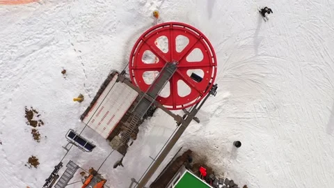 Top down view of the ski lift in winter.Skiers and snowboarders do the same. Stock Footage 202317271