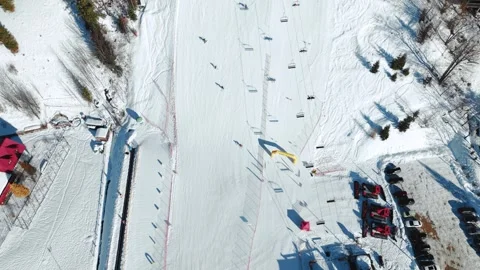 Top Down View of Ski Slope with Skiers on Sunny Winter Day Stock Footage 328481334