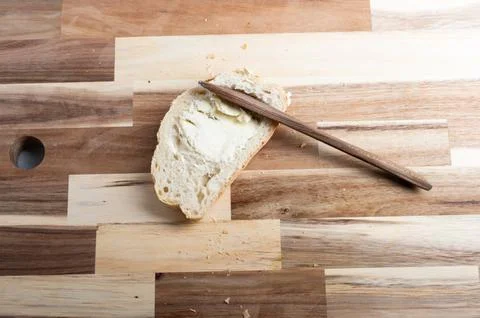 Top-down view of sliced bread on wooden background  rustic food scene Stock Photos