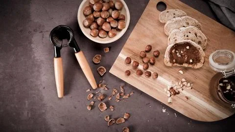 Top Down View of Sliced Bread with Hazelnut Chocolate Spread and Whole Nuts 스톡 사진