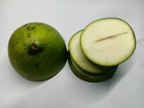Top down view of sliced young green mango on white background Stock Photos