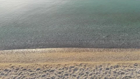 Top-down view, small waves rolling onto the shore. Stock Footage 222603262
