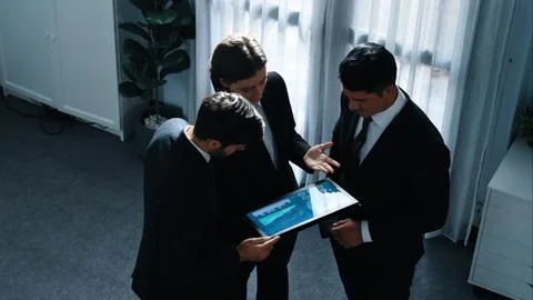 Top down view of smart manager standing with team and analyze data. Directorate. Stock Photos
