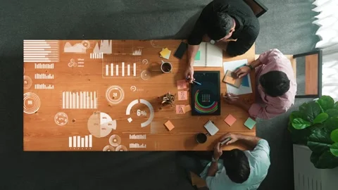 Top down view of smart start up team discuss about financial graph. Convocation. Stock Footage 267613043