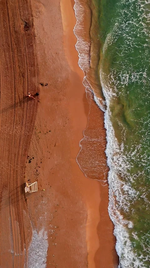 Top-down view of Spanish beach shoreline with waves 動画素材 311621106