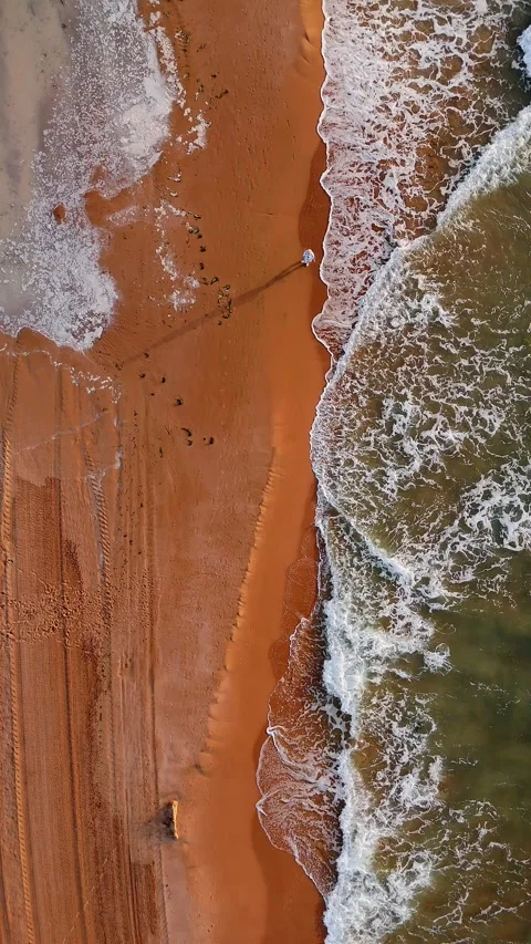 Top-down view of Spanish beach shoreline with waves Stock Footage 312217523