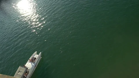 Top down view of a speed boat passing on the Colorado River Stock Footage 98358856