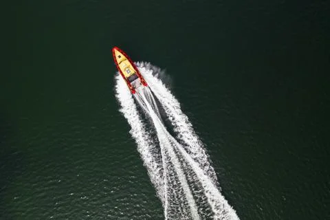 Top down view on speed movement of rescue motorboat. Stock Photos